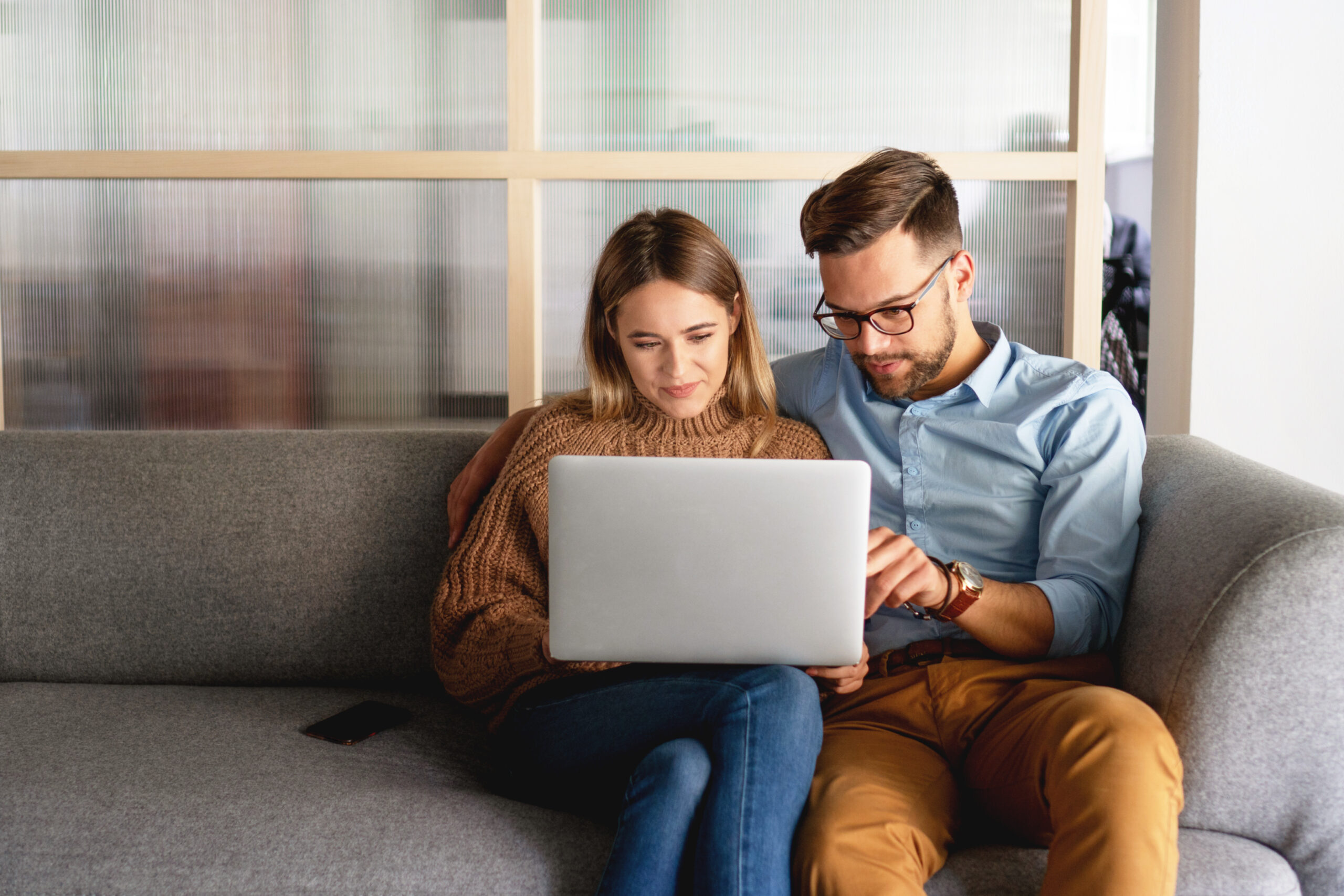 Young couple selecting a realtor to work with