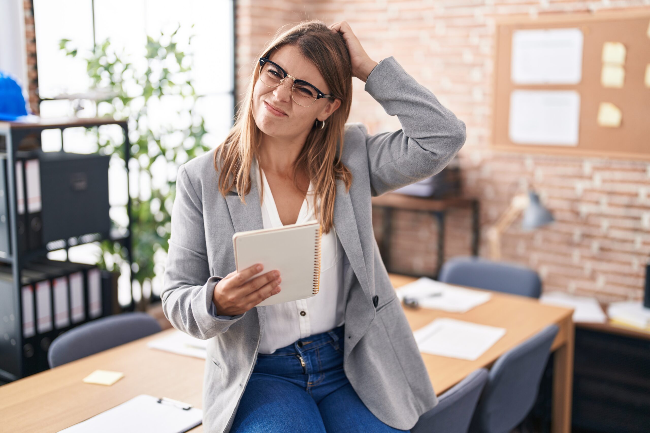 Young woman wondering if now is the time to buy or sell or invest in real estate